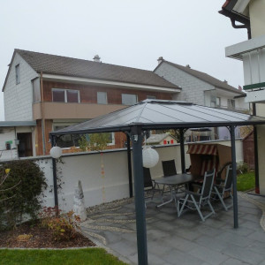 Helmes Gartenbau - Gartenhaus und Carports